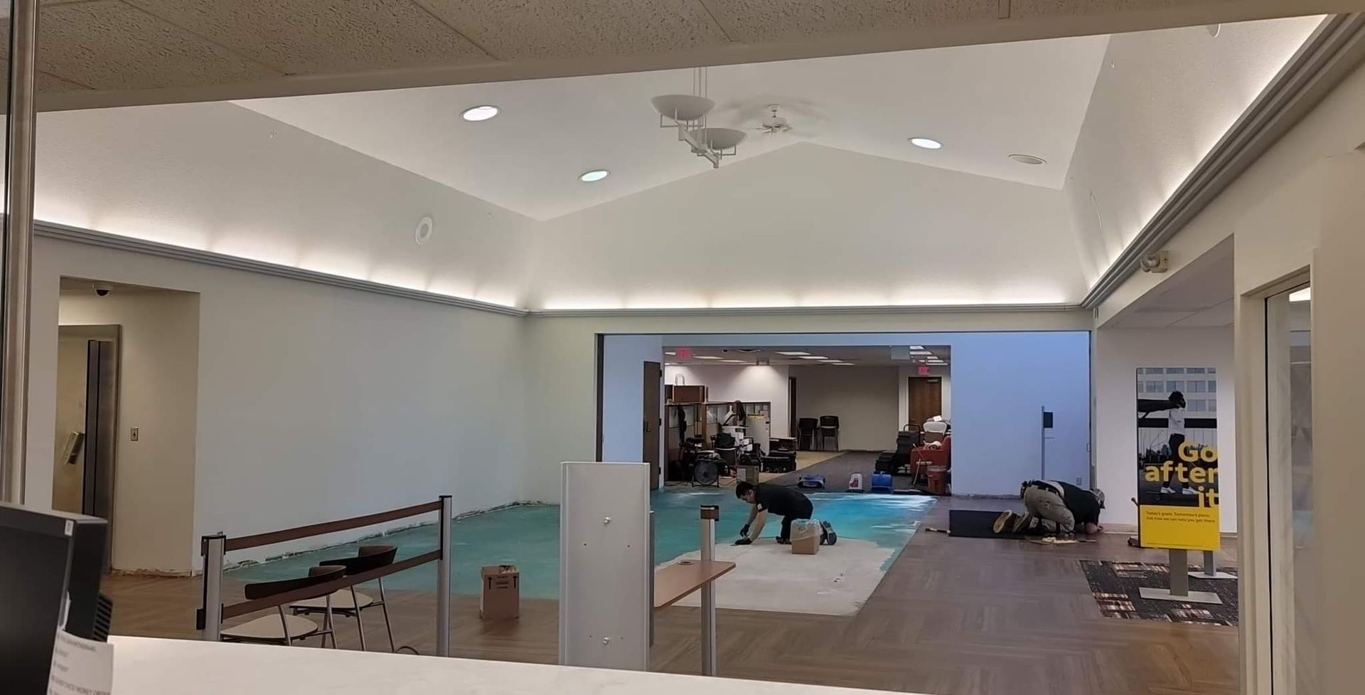 A large room with a swimming pool in the middle of it