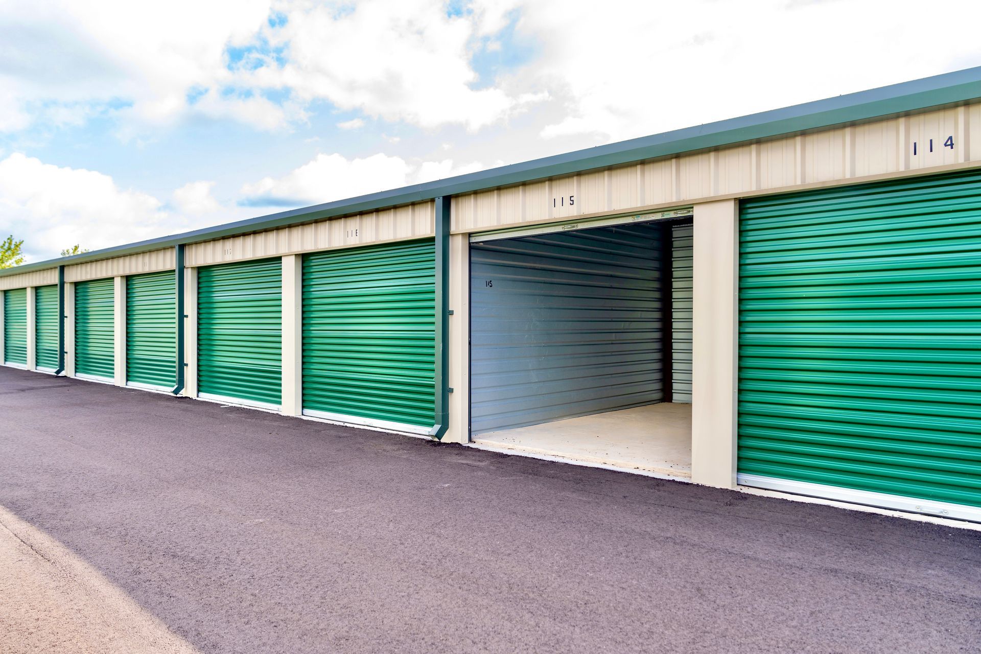 Green roll up doors featured in every mini storage unit. 