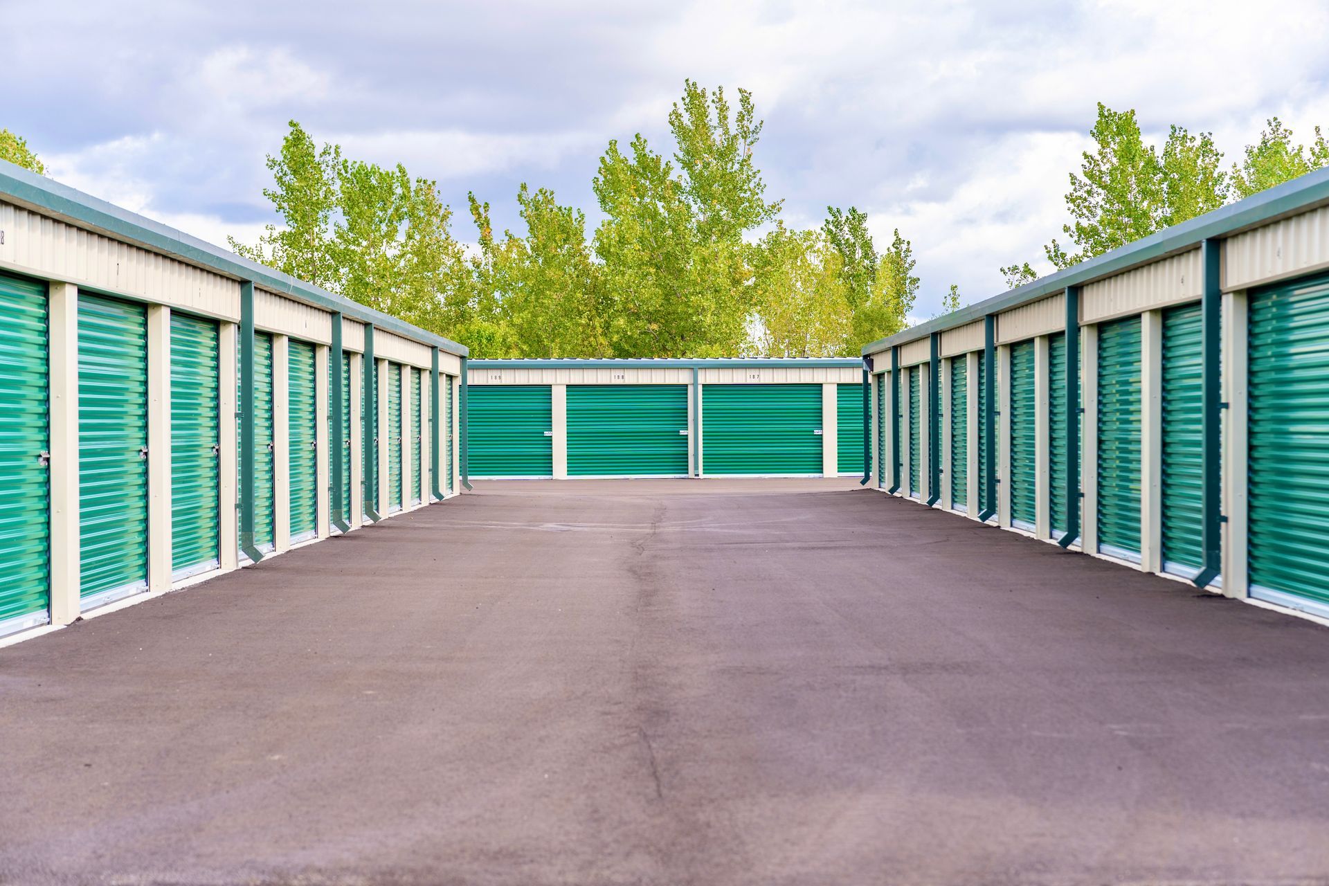 Drainage and paved asphalt road in storage driveway. 