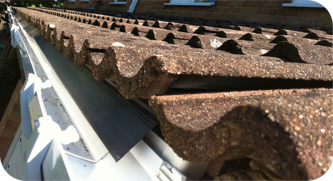 A close up of a gutter on a roof