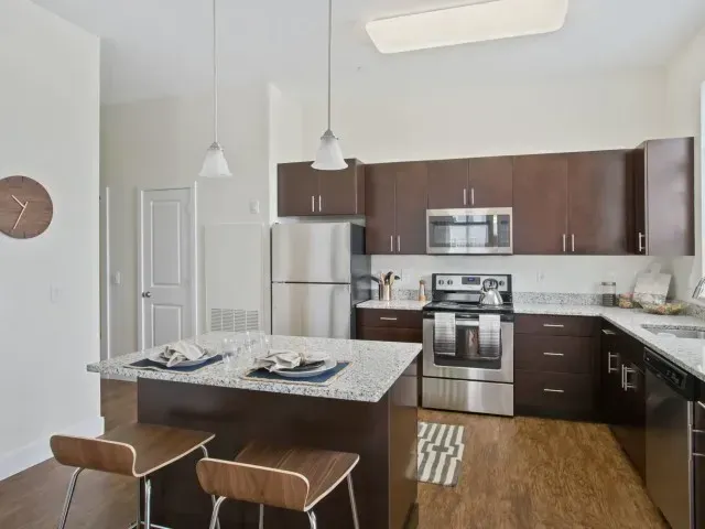 Corsa Tuscan Village spacious apartment kitchen with oversized island.