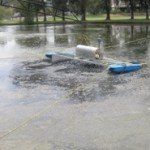 A pond aerator in a body of water