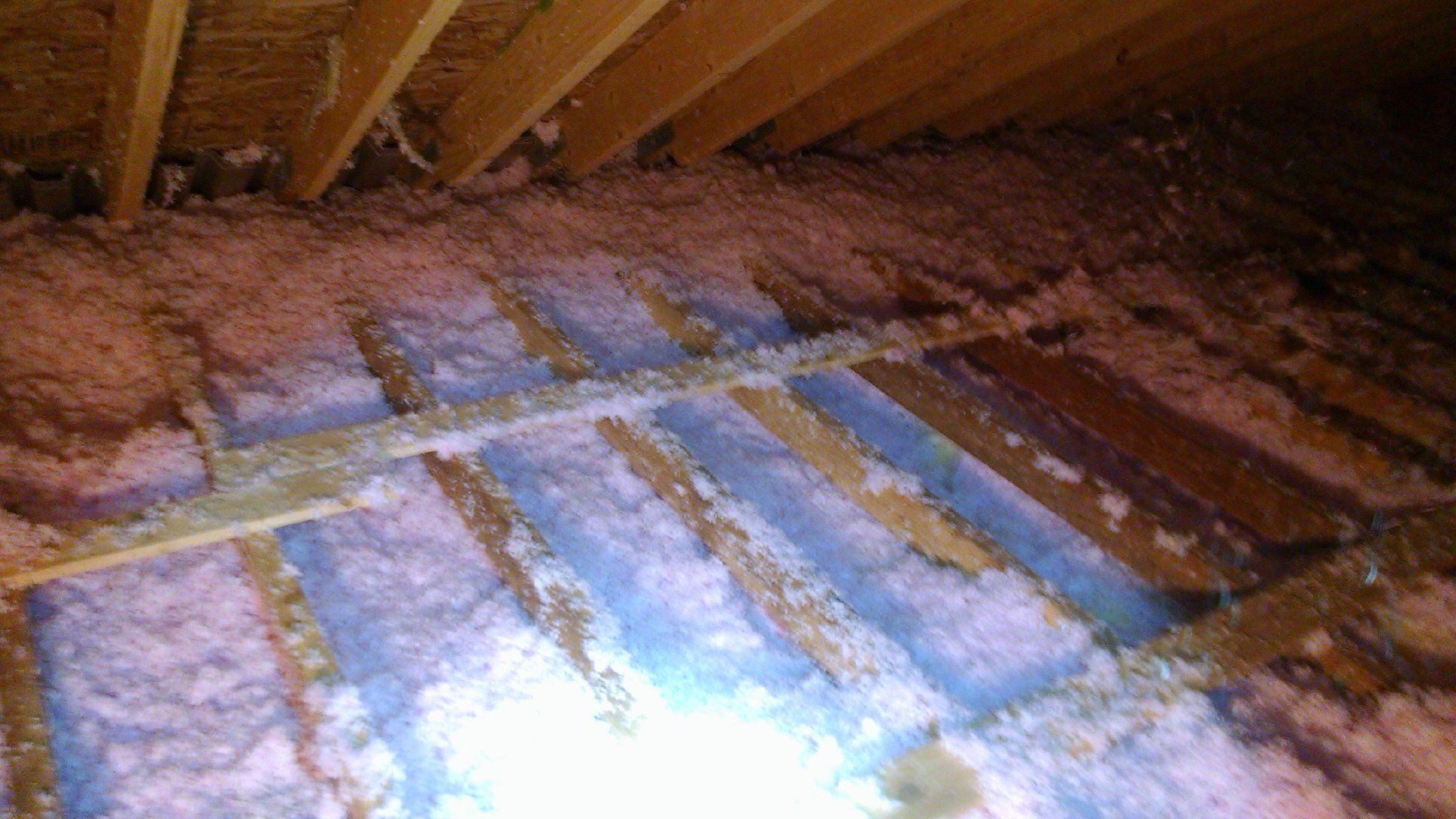 Attic with foam to improve energy efficiency in Albany, NY
