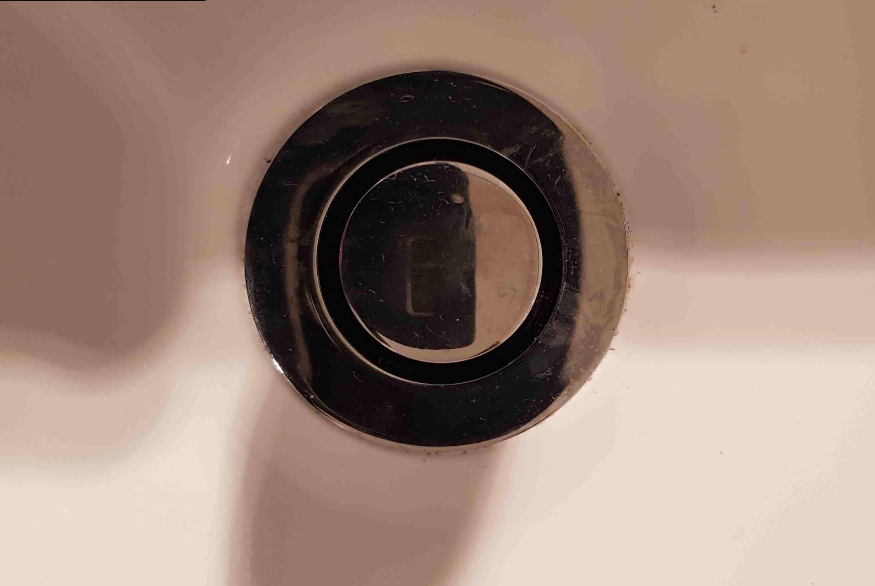 A close up of a drain hole in a bathroom sink.  — Jobs2BDone in Kincumber, NSW