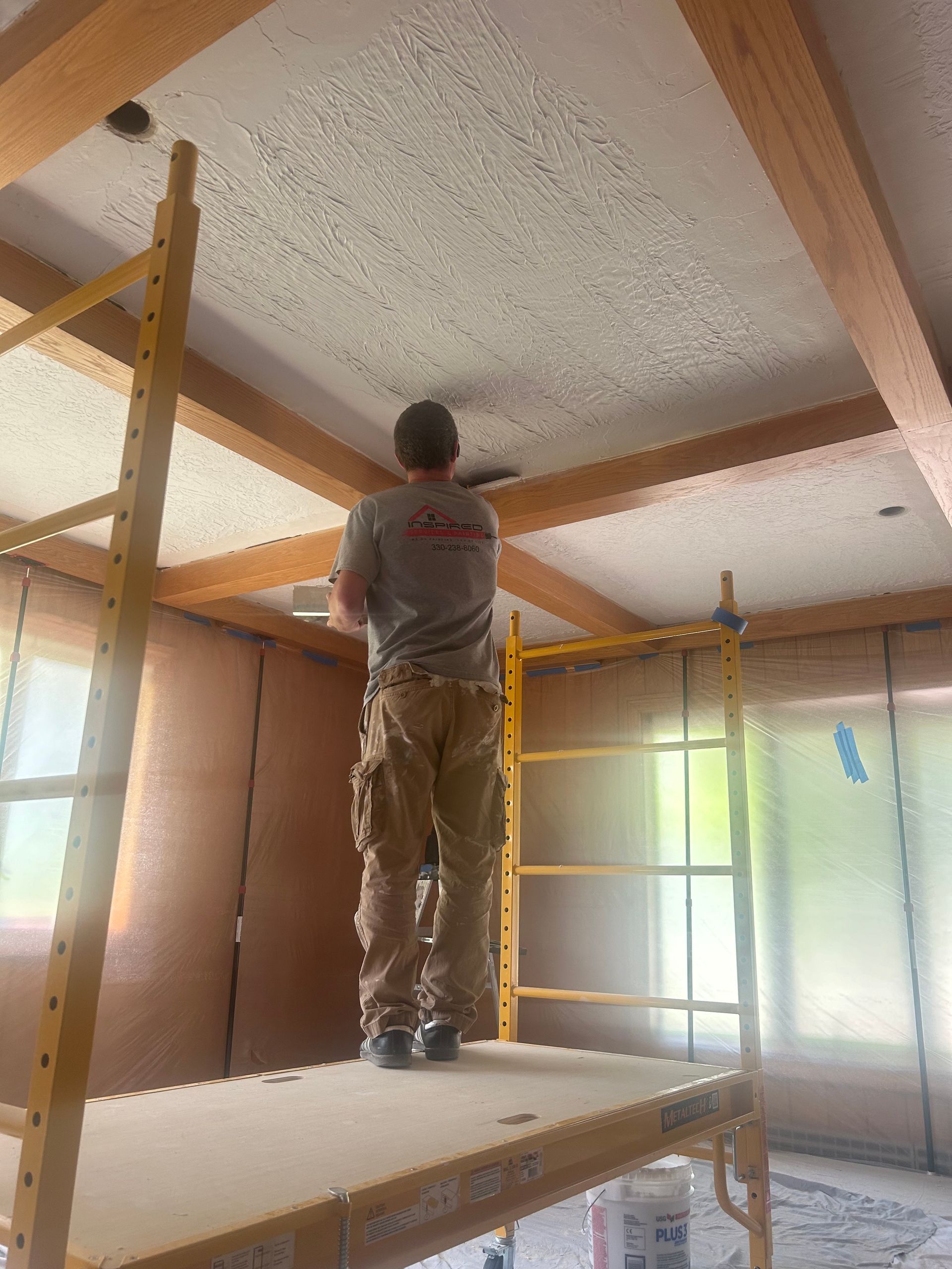 Professional painter applying new ceiling texture in Bath Ohio by Inspired Services & Painting
