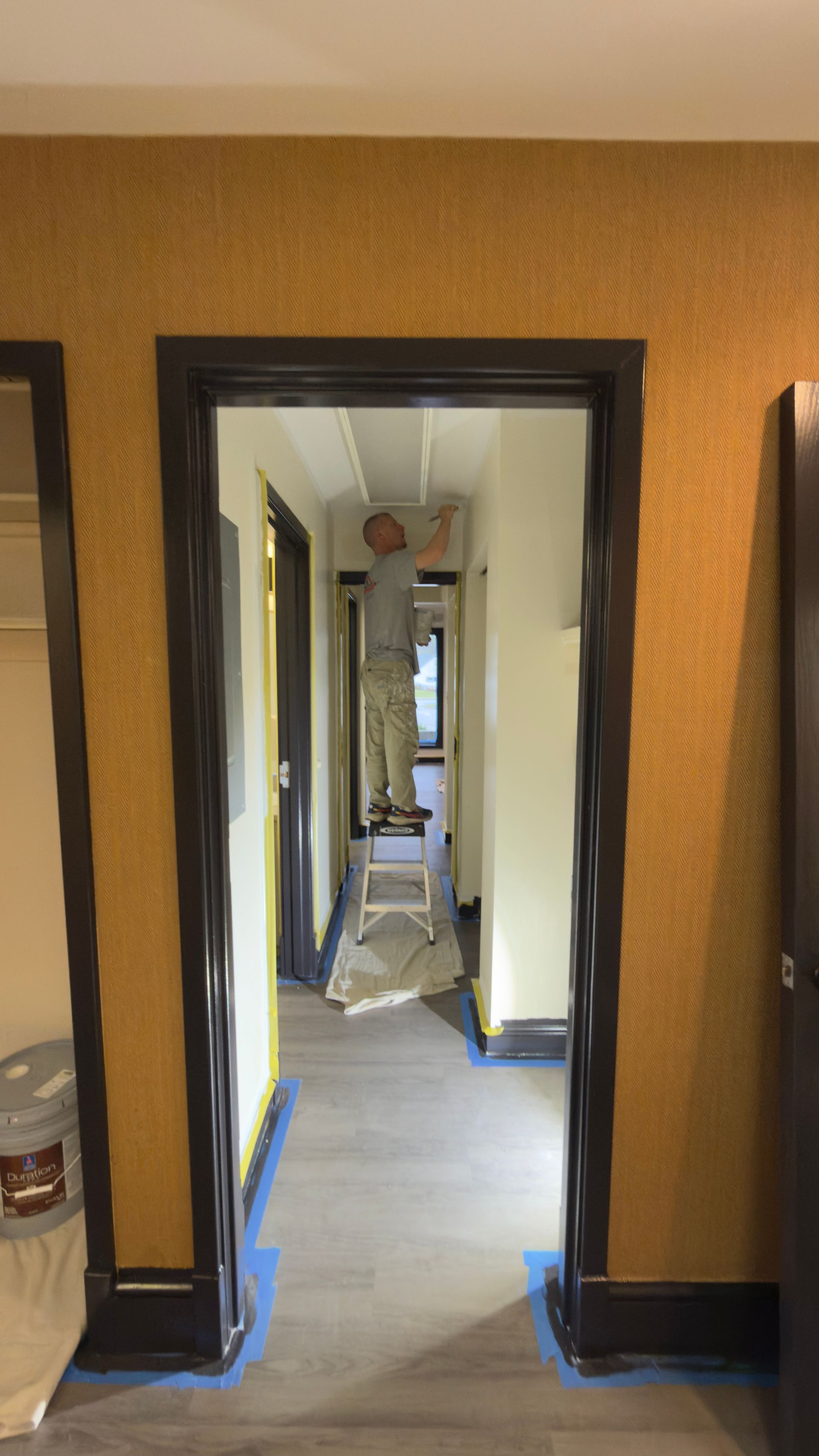 Professional painter working at a dental office in Cuyahoga Falls Ohio by Inspired Services & Painting