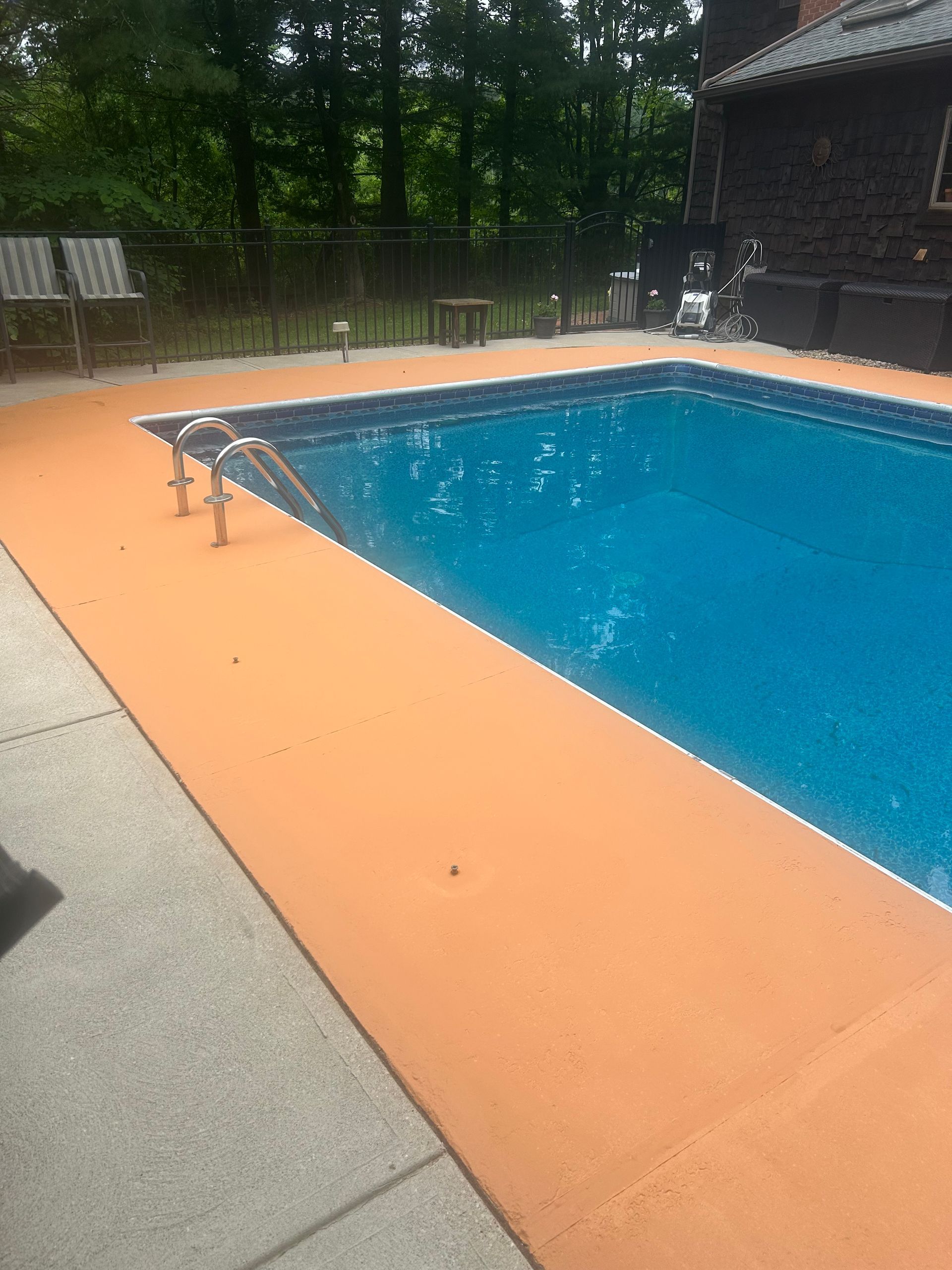 Finished pool deck painting after crack repair in Bath Ohio by Inspired Services & Painting