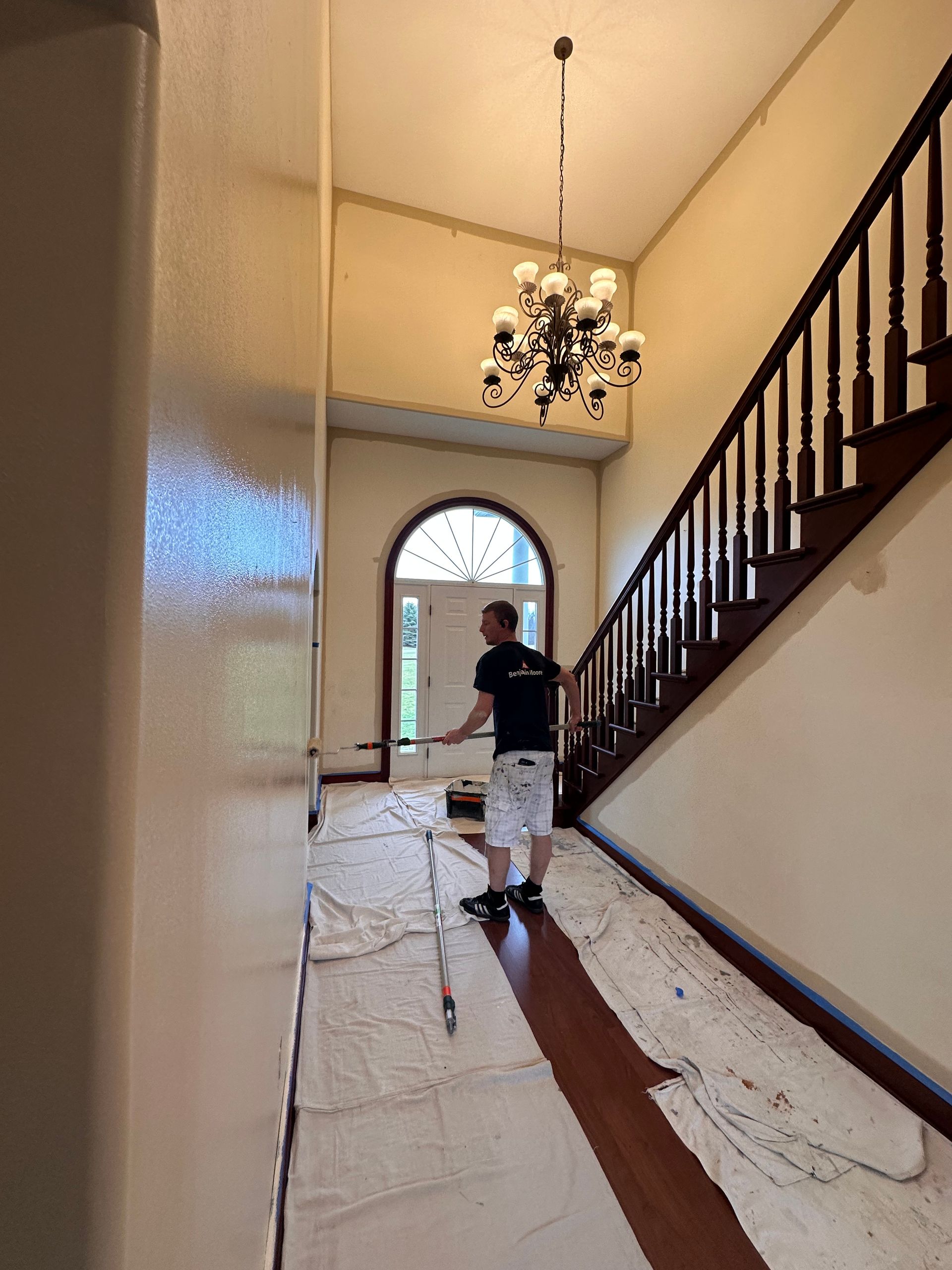 Professional painting crew completing interior painting work in a Northeast Ohio home