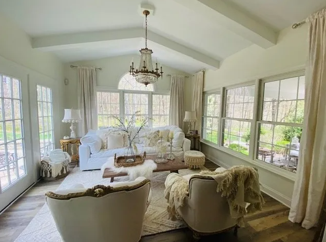 A man and a woman are painting a house together.