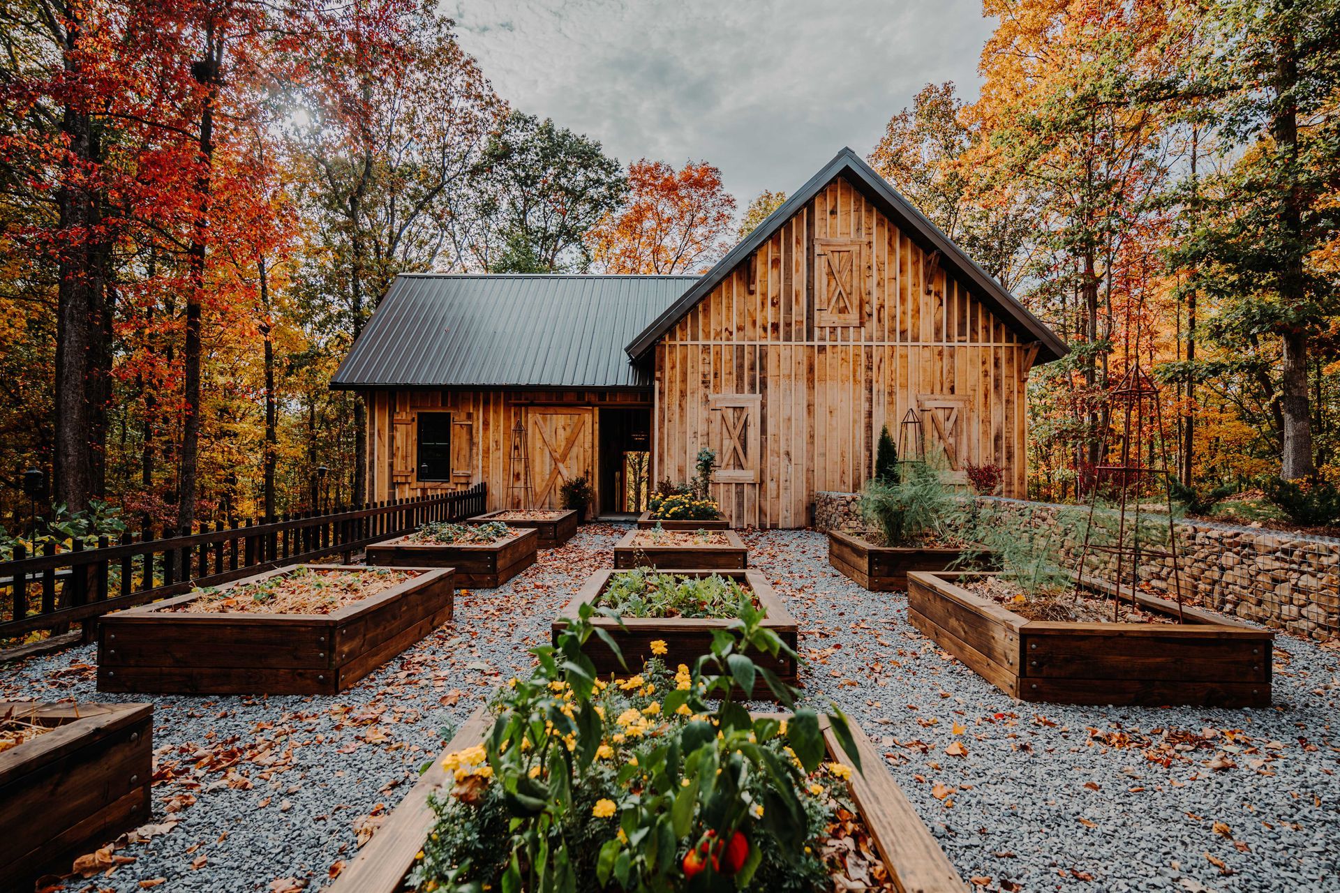 A wooden house with a garden in front of it.