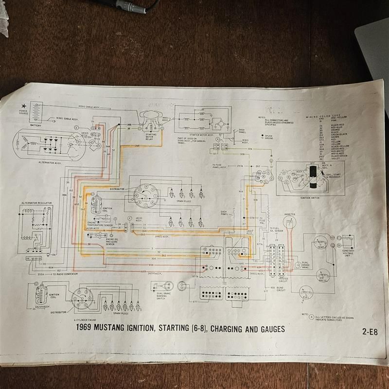 A drawing of a wiring diagram for a mustang sitting on a table.