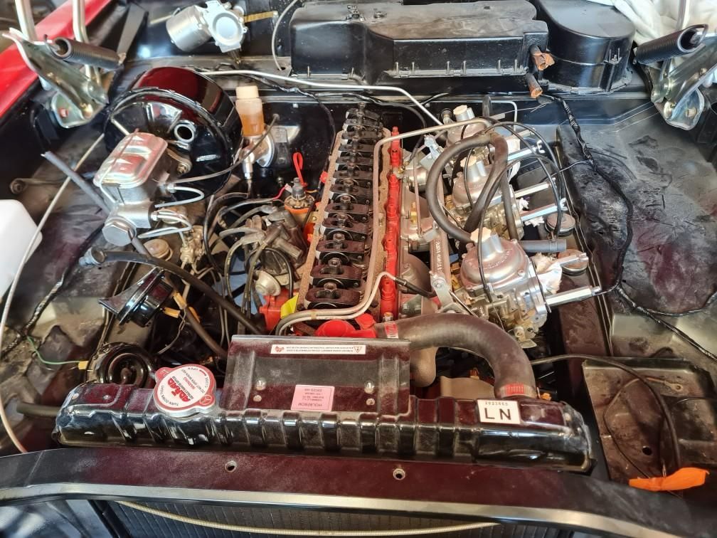 A close up of a car engine with a radiator