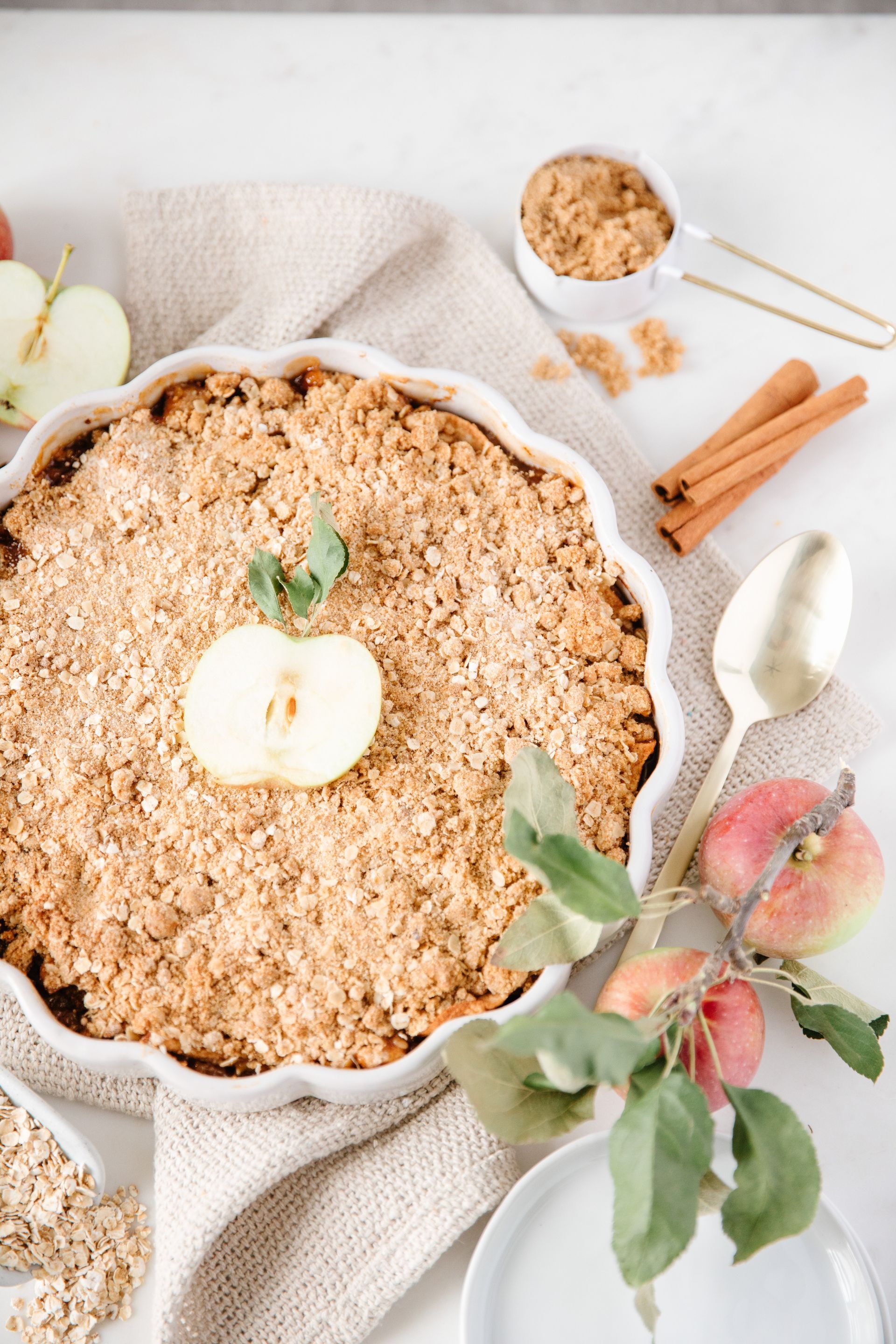 a pie with an apple on top of it is sitting on a table