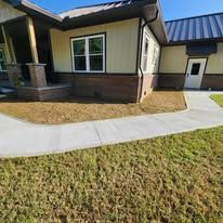 A house with a sidewalk leading to the front entrance. A house with a sidewalk leading to the front entrance.