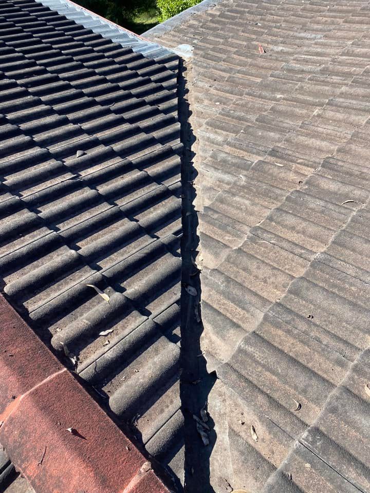 A Close Up Of A Tiled Roof With A Gutter On It — Out On A Limb Tree and Garden Care In Bodalla, NSW