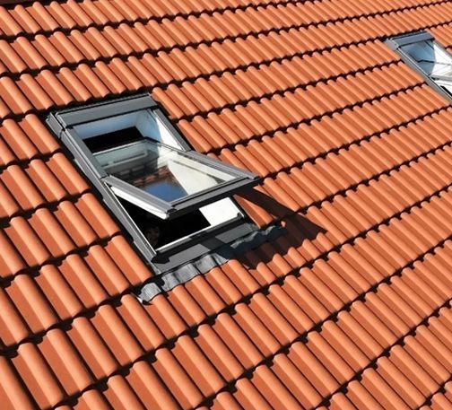 A Roof With A Skylight Installed In The Middle Of It — ACT Roofing in Ngunnawal, ACT