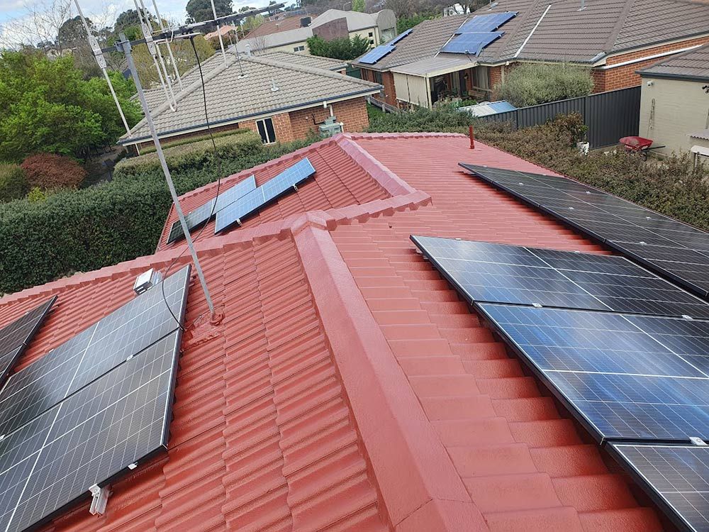 Many Solar Panels Are Installed On The Roof Of A House — ACT Roofing in Ngunnawal, ACT