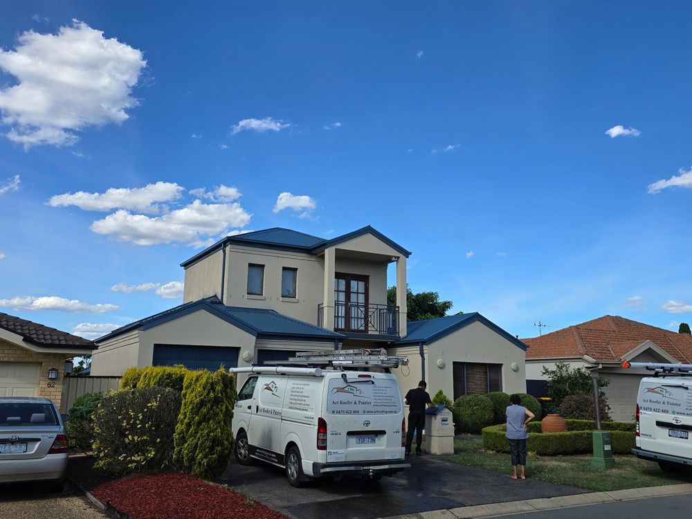 Trees Around the House with Blue Roofing