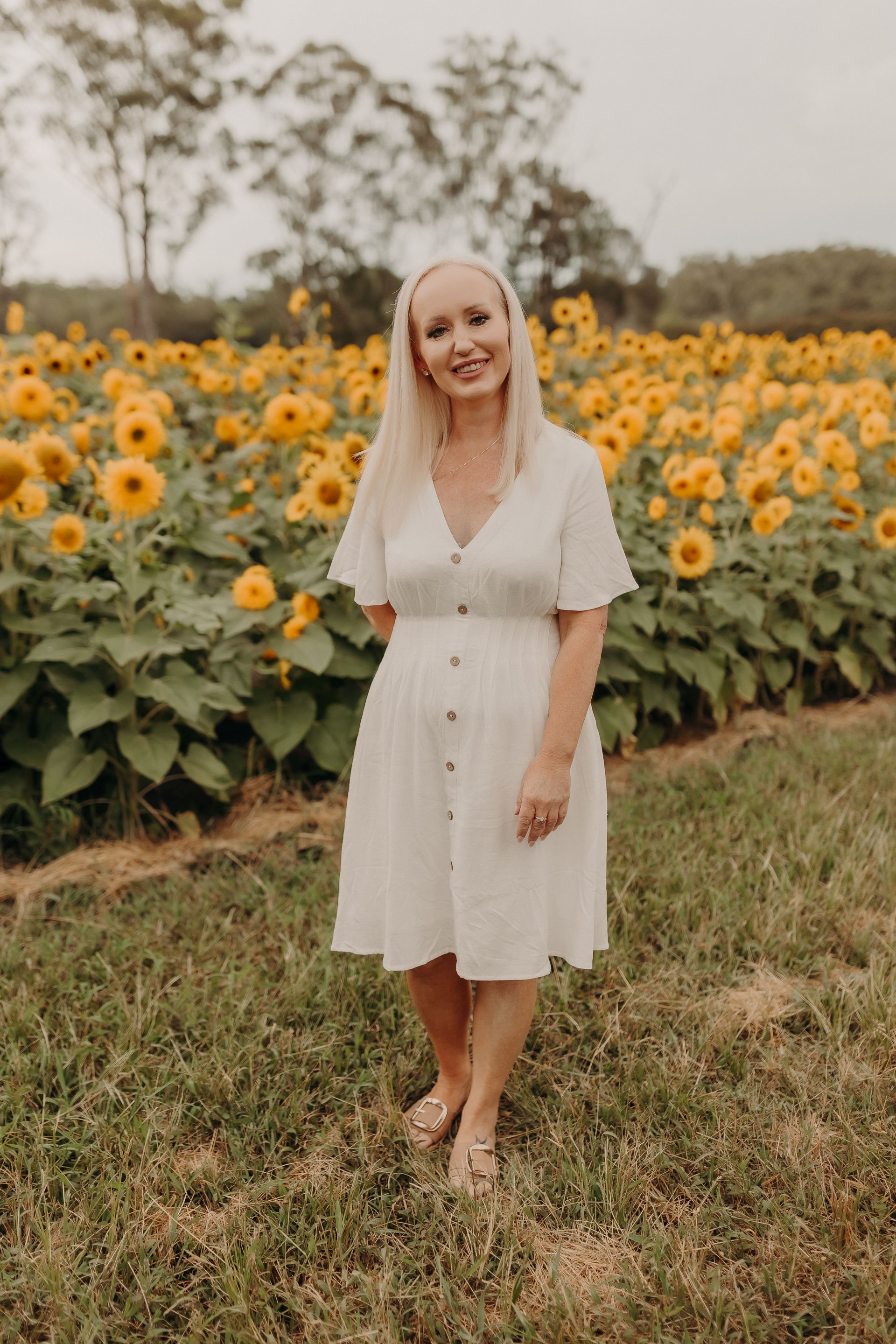 Red flower blooming on a cliff overlooking the ocean under a cloudy sky — Inner Peace Counselling Services in Kanwal, NSW