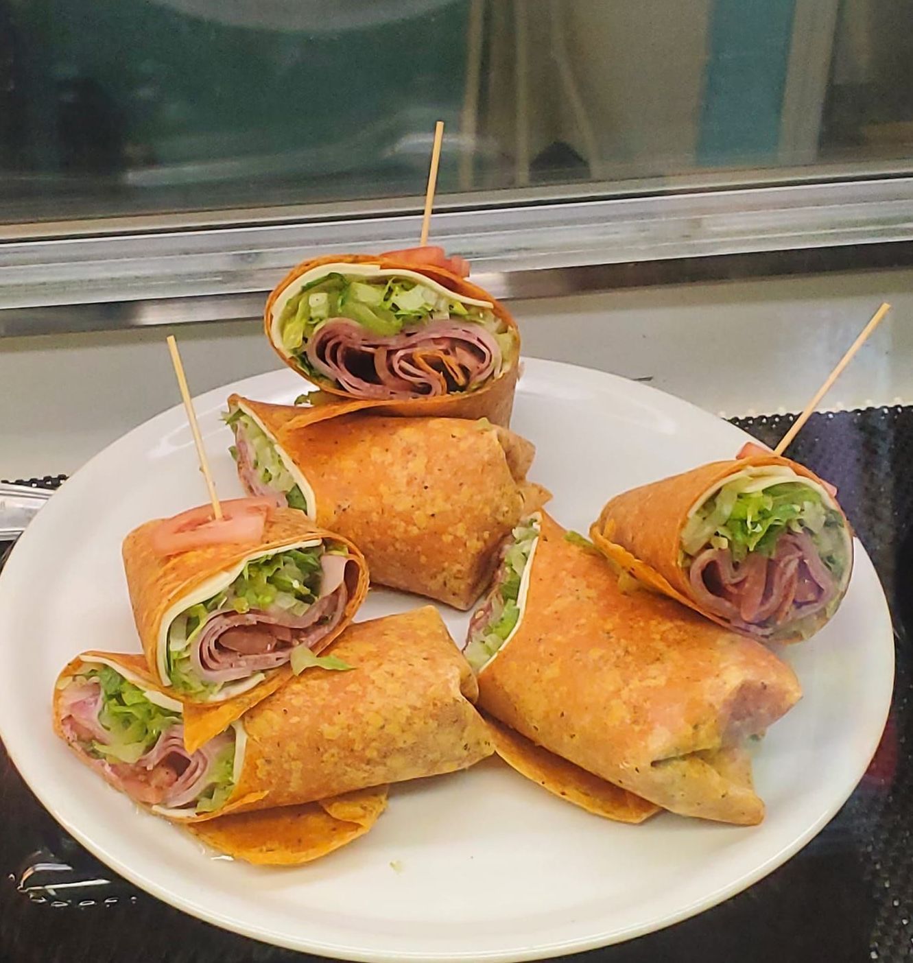 a white plate topped with sandwiches and dill