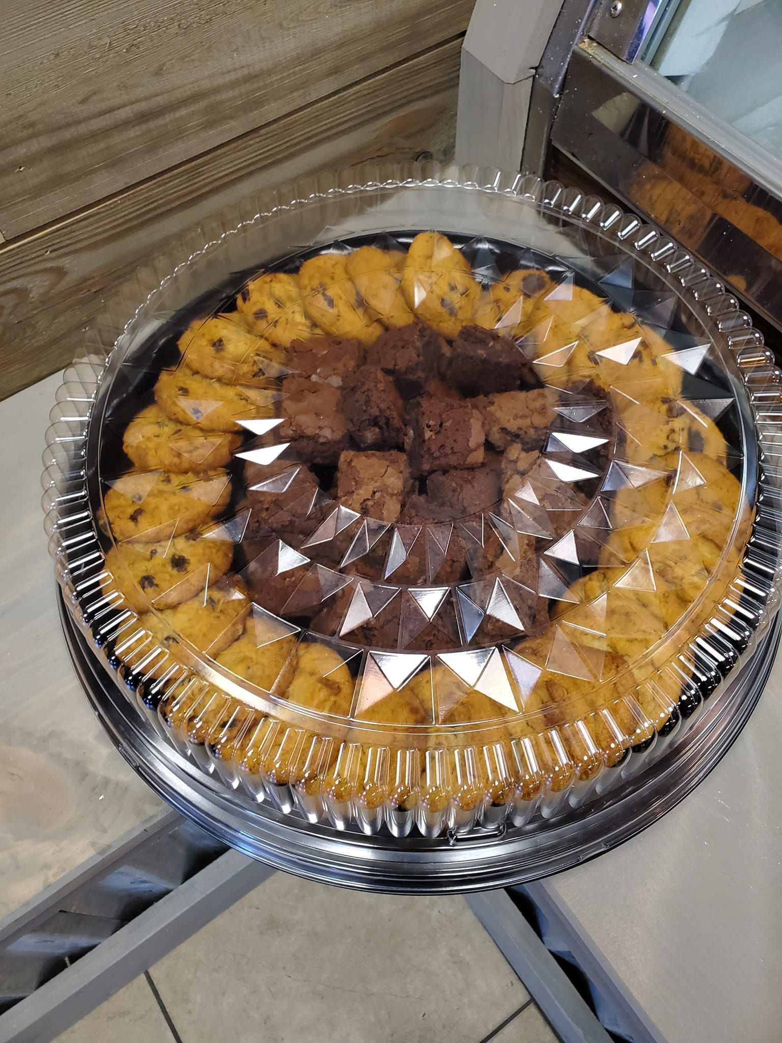 a plastic tray filled with cookies and brownies