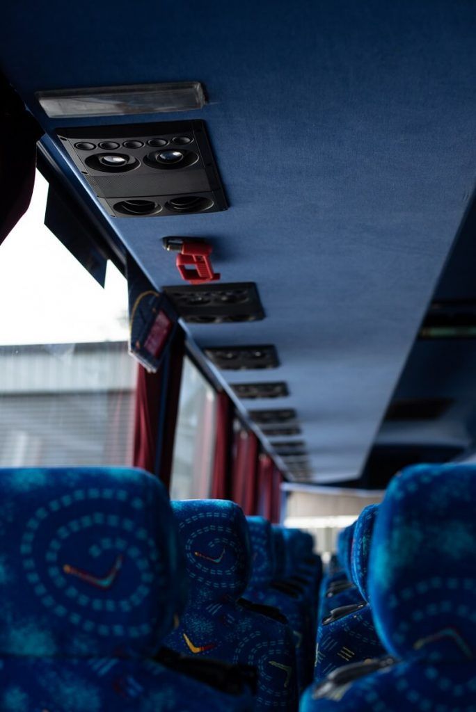View Down a Bus Aisle With Blue Patterned Seats — J & B Bus and Coach Pty Ltd In Byron Bay, NSW