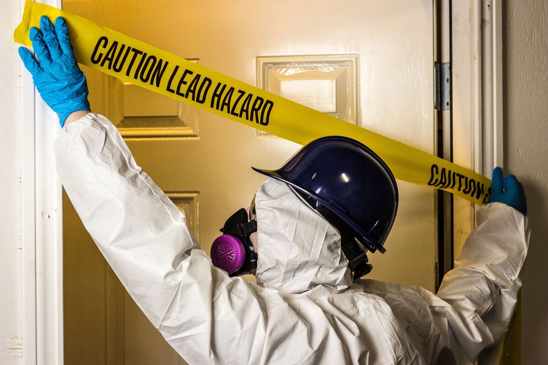 Person in hazmat suit places 