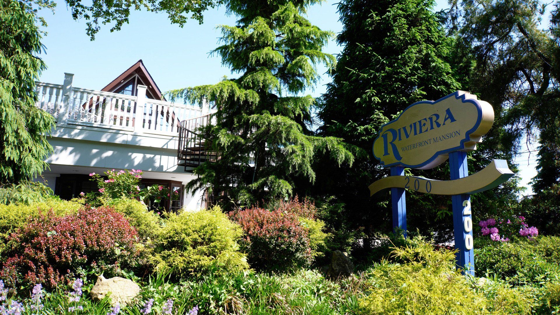 A sign that says riviera in front of a house