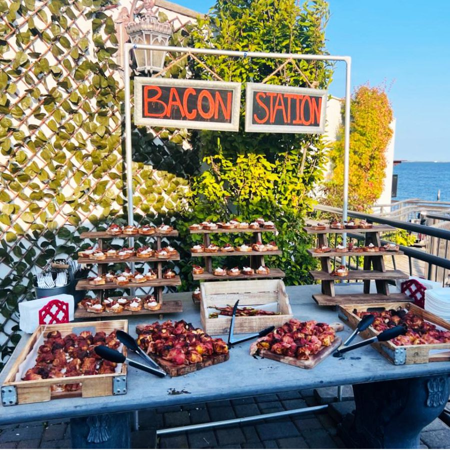 A table with a sign that says bacon station