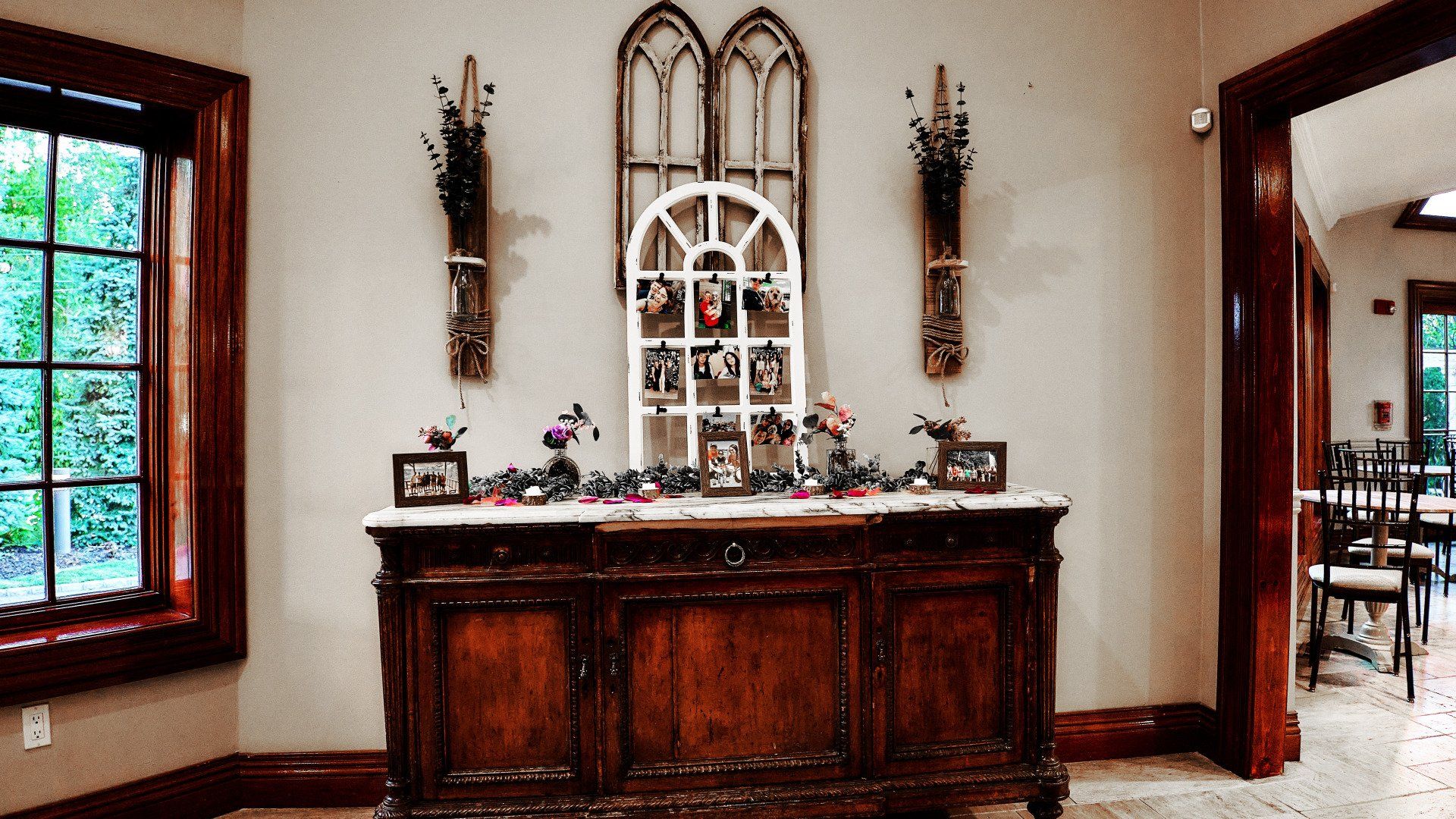 A wooden dresser is sitting in a room next to a window.