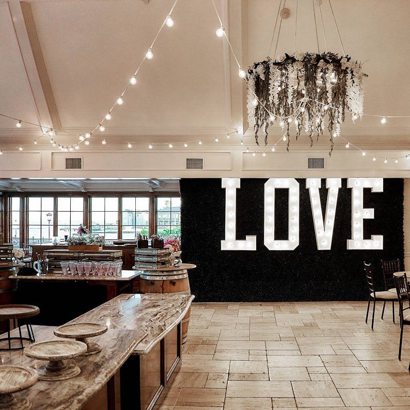 A restaurant with a large sign that says love