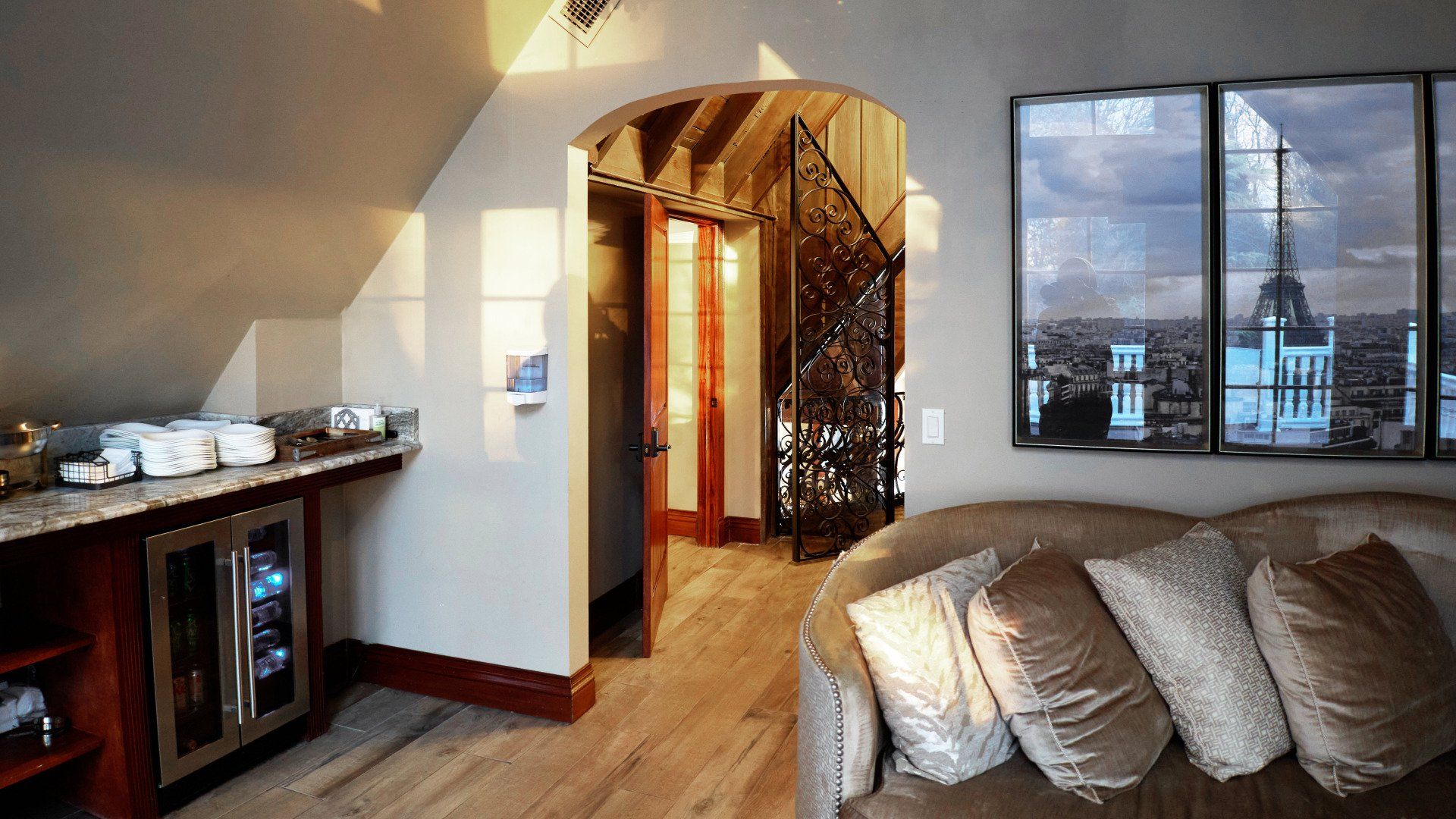 A living room with a couch and pictures on the wall