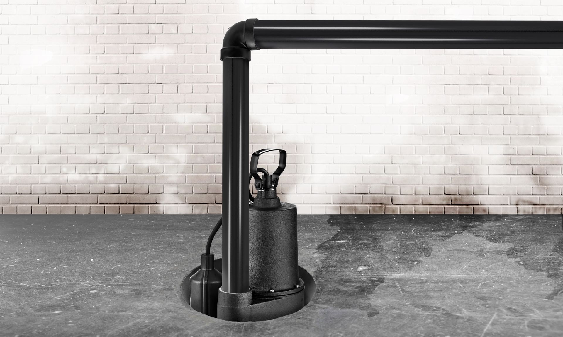 Submersible water pump for flood prevention on a wet basement floor.