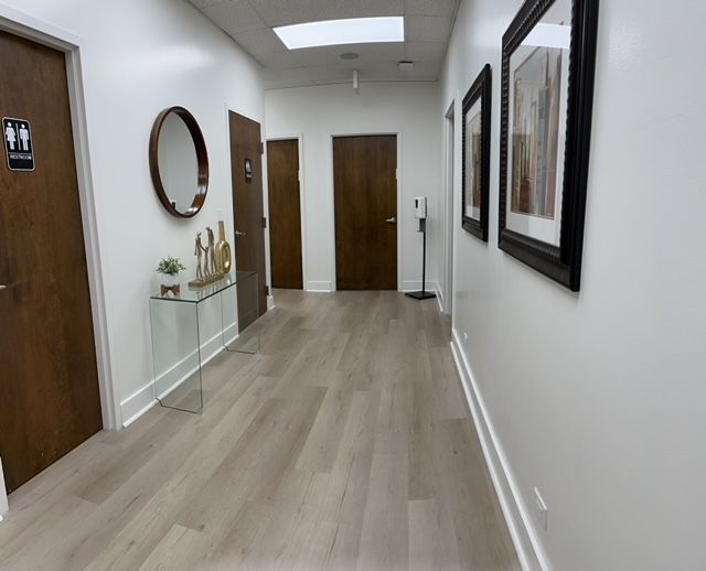 A long hallway with a mirror on the wall at orion tms therapy