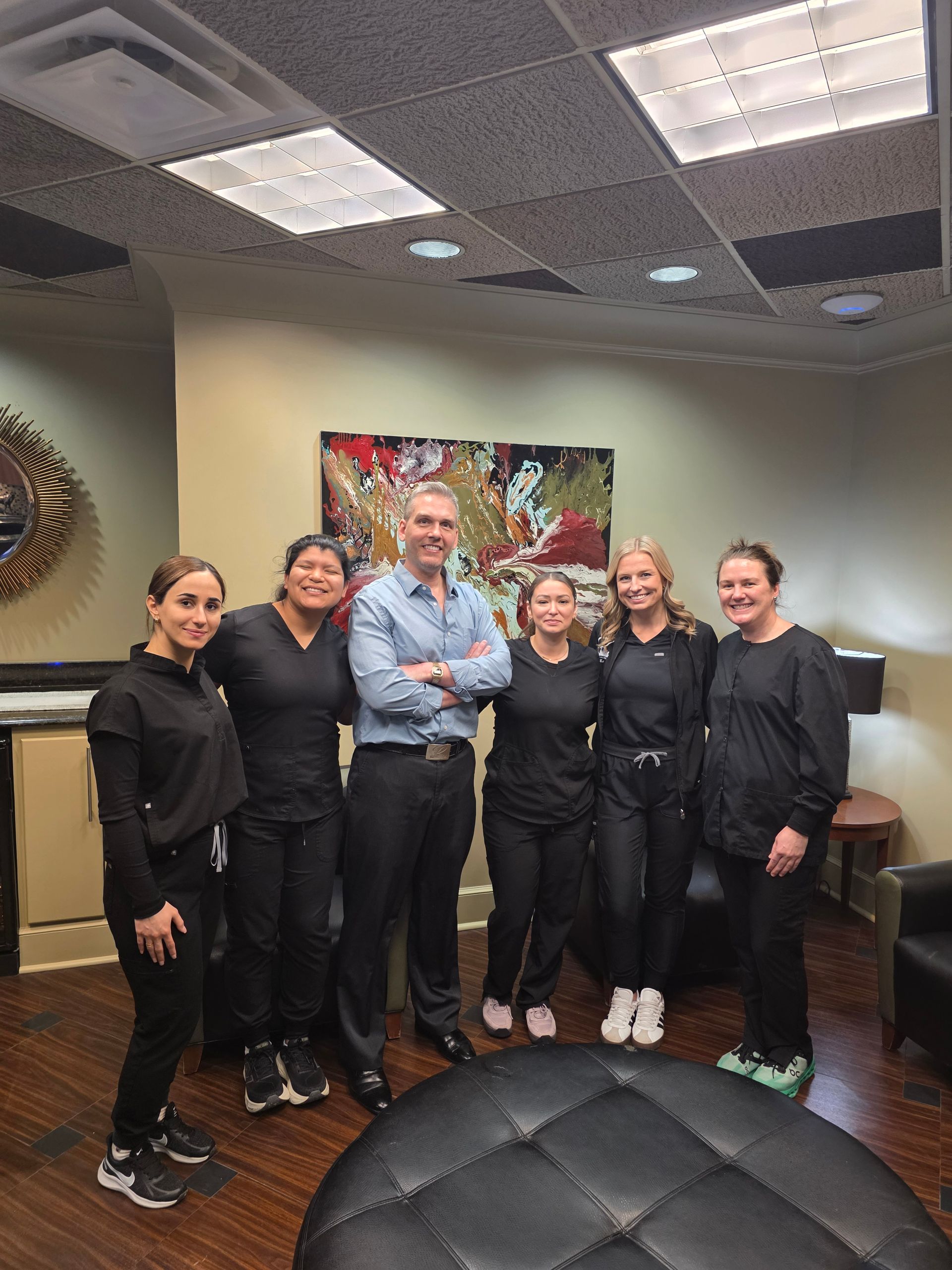 A group of the staff at the Country Club Plaza, including hygienists and Dr. Darren Perry