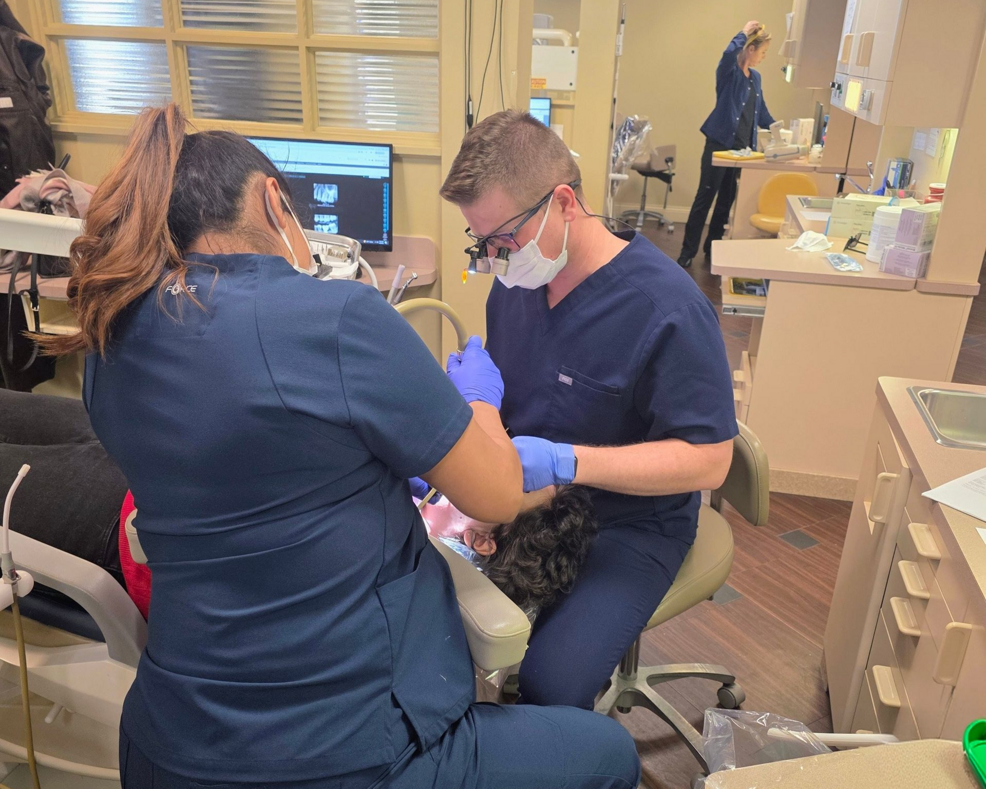 Dr. Neeland taking great care of a patient