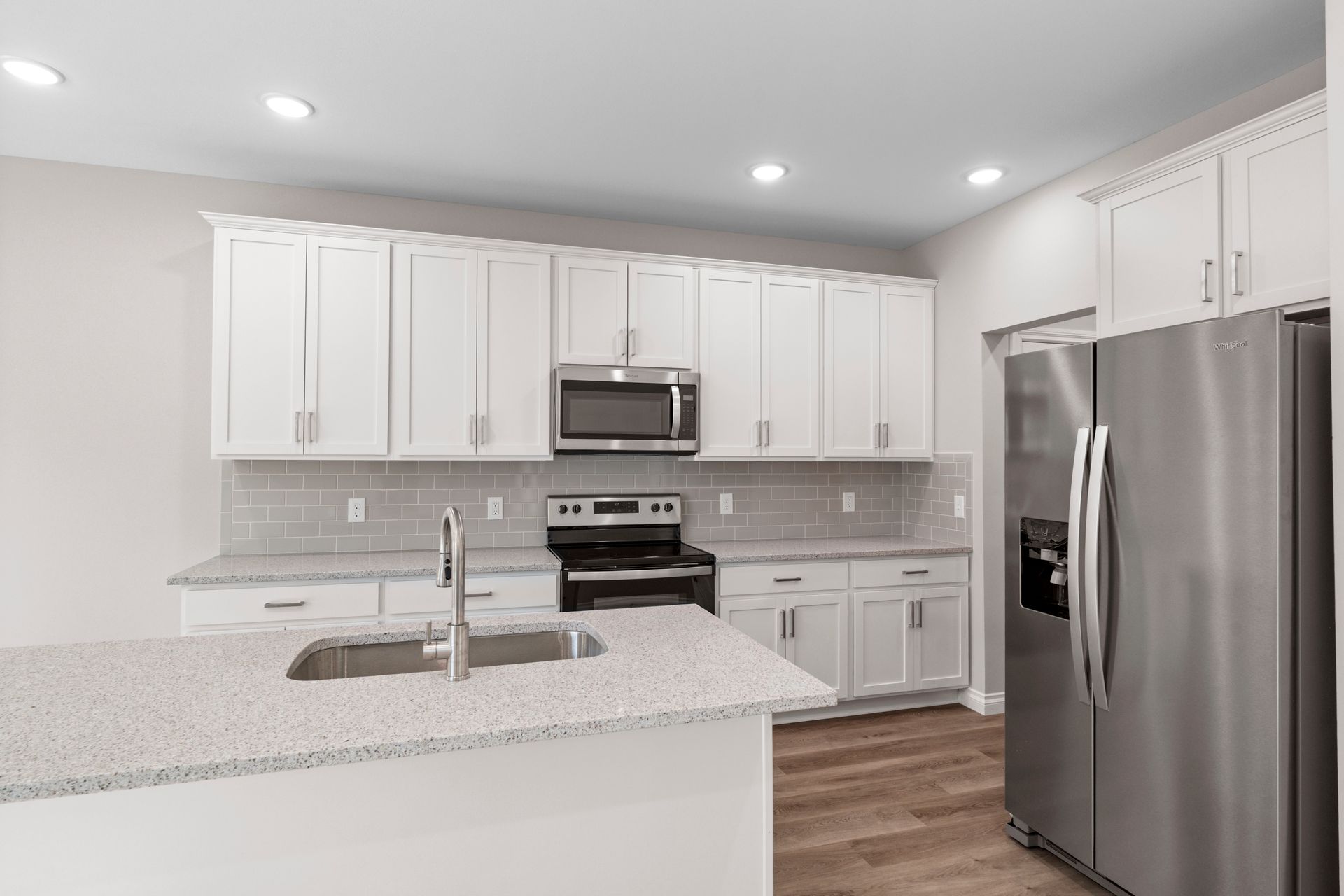 Photo of a kitchen with an island sink