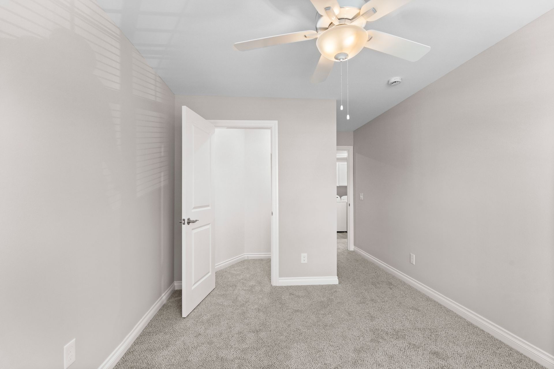Photo of a room with a walk-in closet