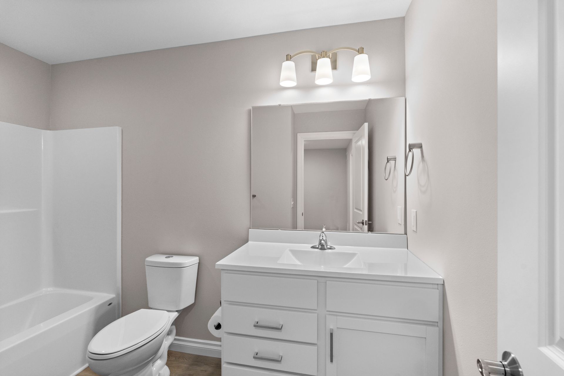 Photo of a bathroom with a bathtub/shower combo