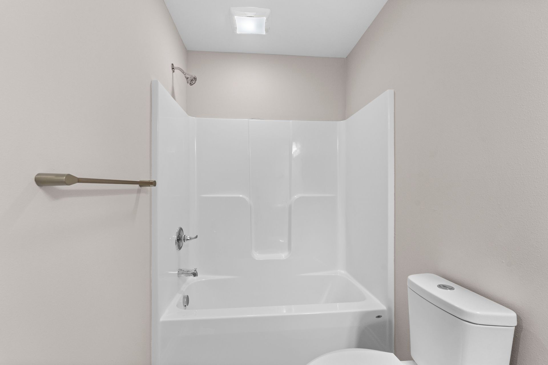 Photo of a bathroom showing a bathtub/shower combo