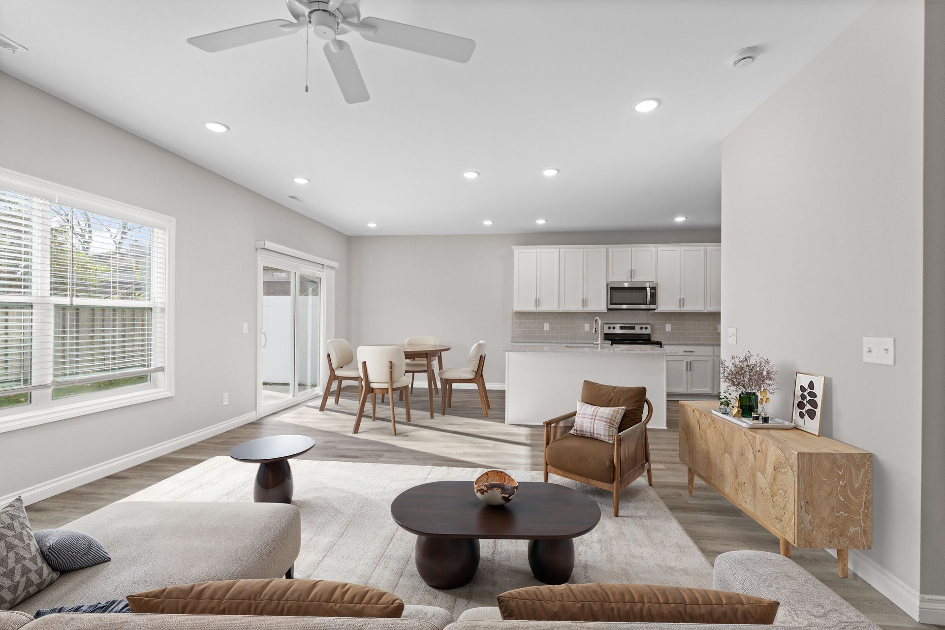 Photo of a large, open space living room with seamless integration into the dining area and kitchen