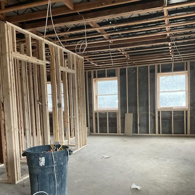 There is a trash can in the middle of the room.