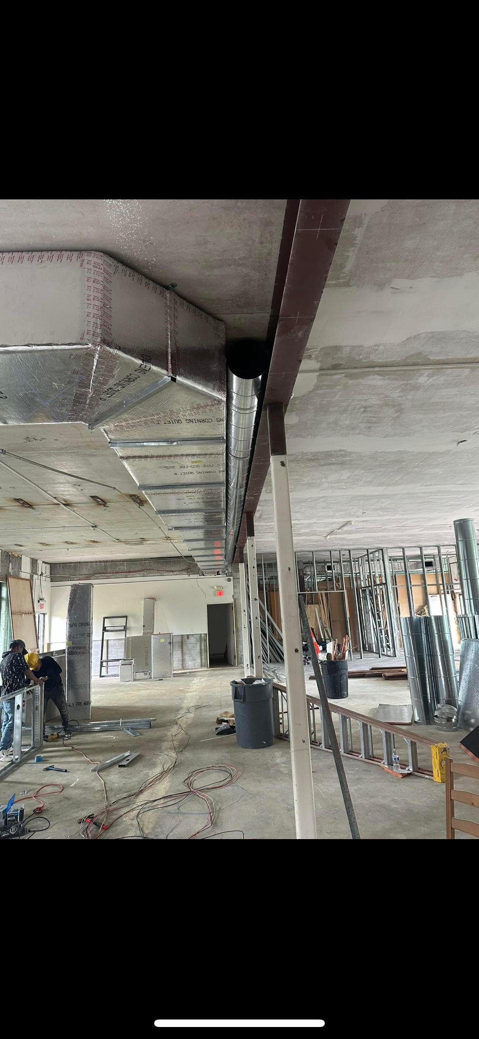 A large room with a lot of graffiti on the walls and ceiling.