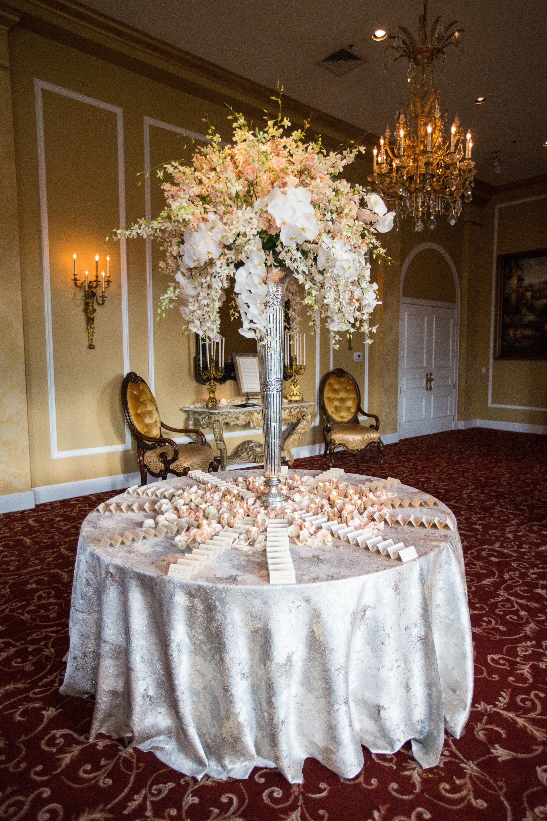 A table with a vase of flowers on it