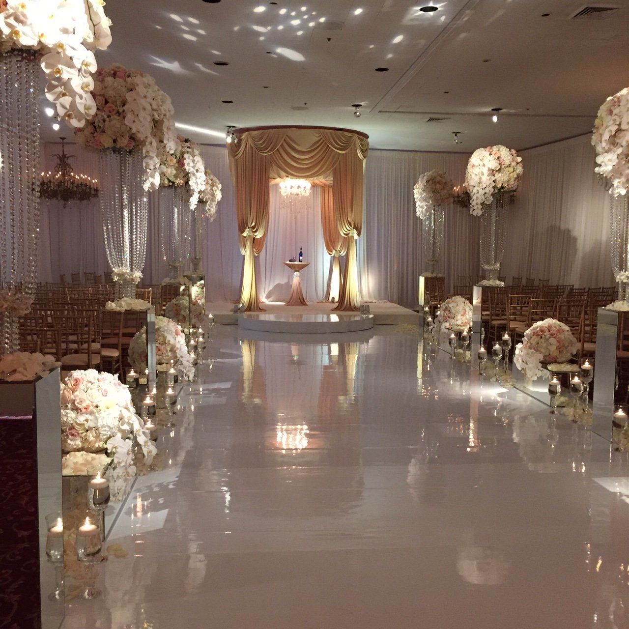 A wedding ceremony is taking place in a large room