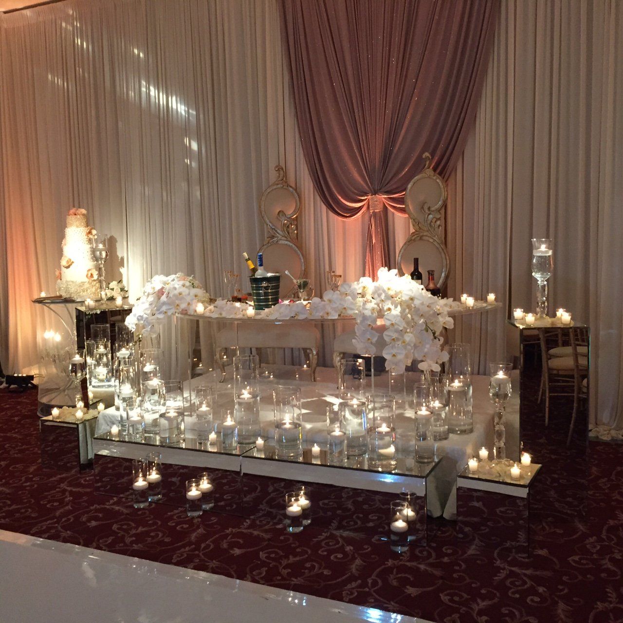A table with candles and flowers on it