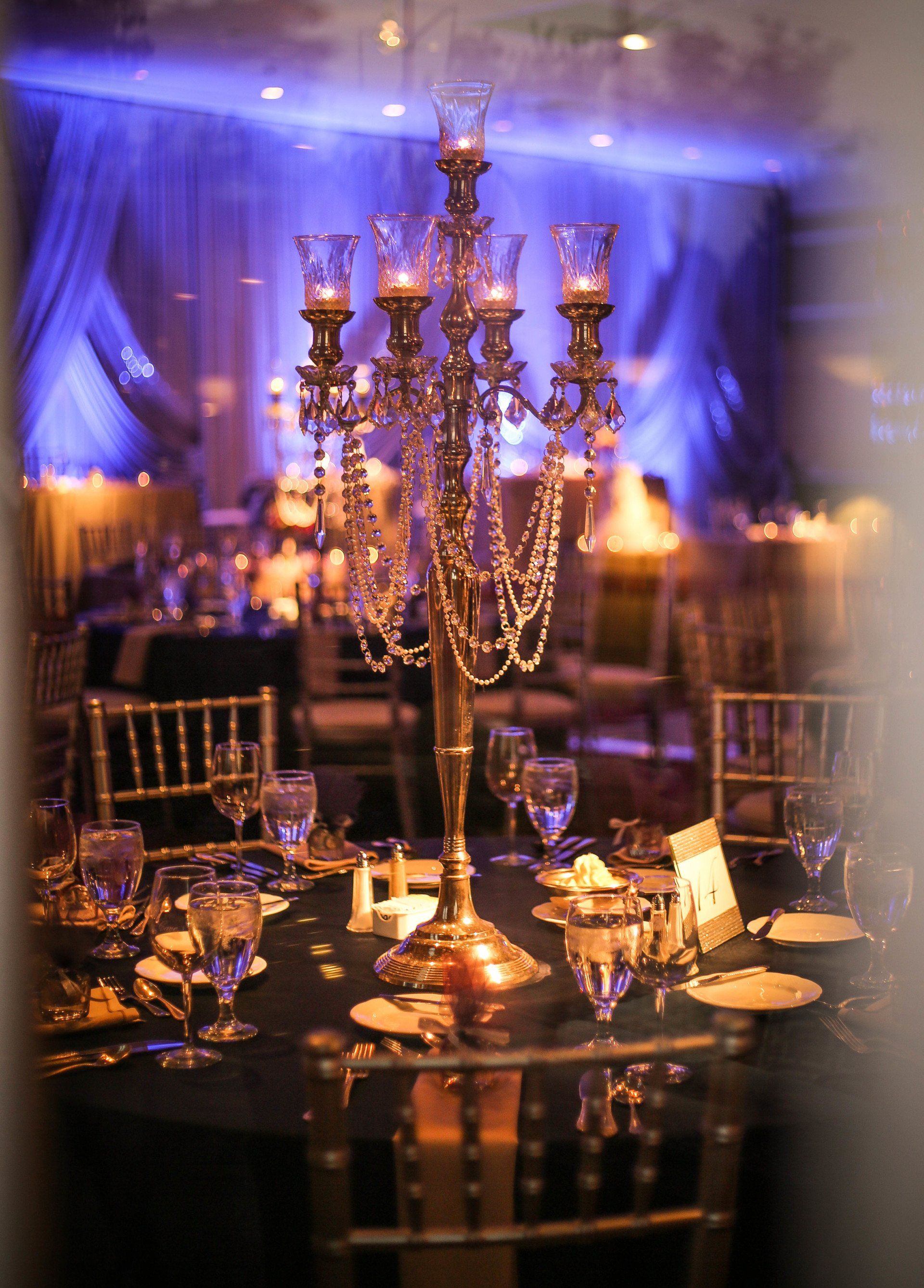 A table with a candelabra and candles on it