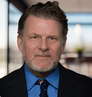 A man, head attorney Robert Byrnes, with a beard is wearing a suit and tie.