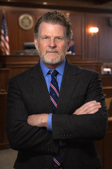 A man, head attorney Robert Byrnes, with a beard is wearing a suit and tie.