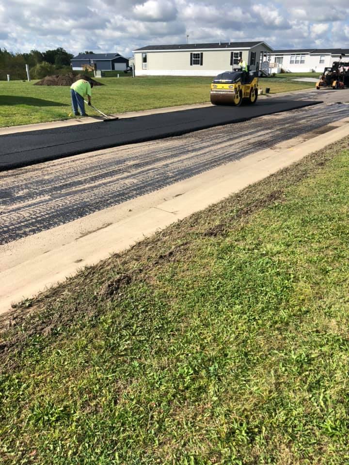 Man Work to Installed Asphalt — Northwood, OH — D & D Paving Inc.